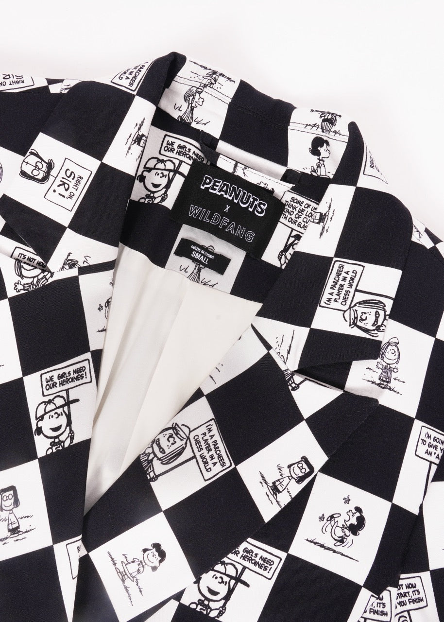 1X=Close up of The Peanuts x Wildfang Double Breasted Blazer in a custom black and white checkered print featuring Peanuts characters. laying on white background.