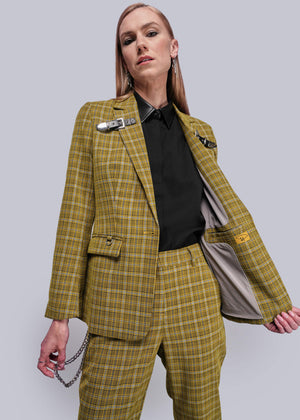 S=Person wearing a yellow plaid suit against a plain background
