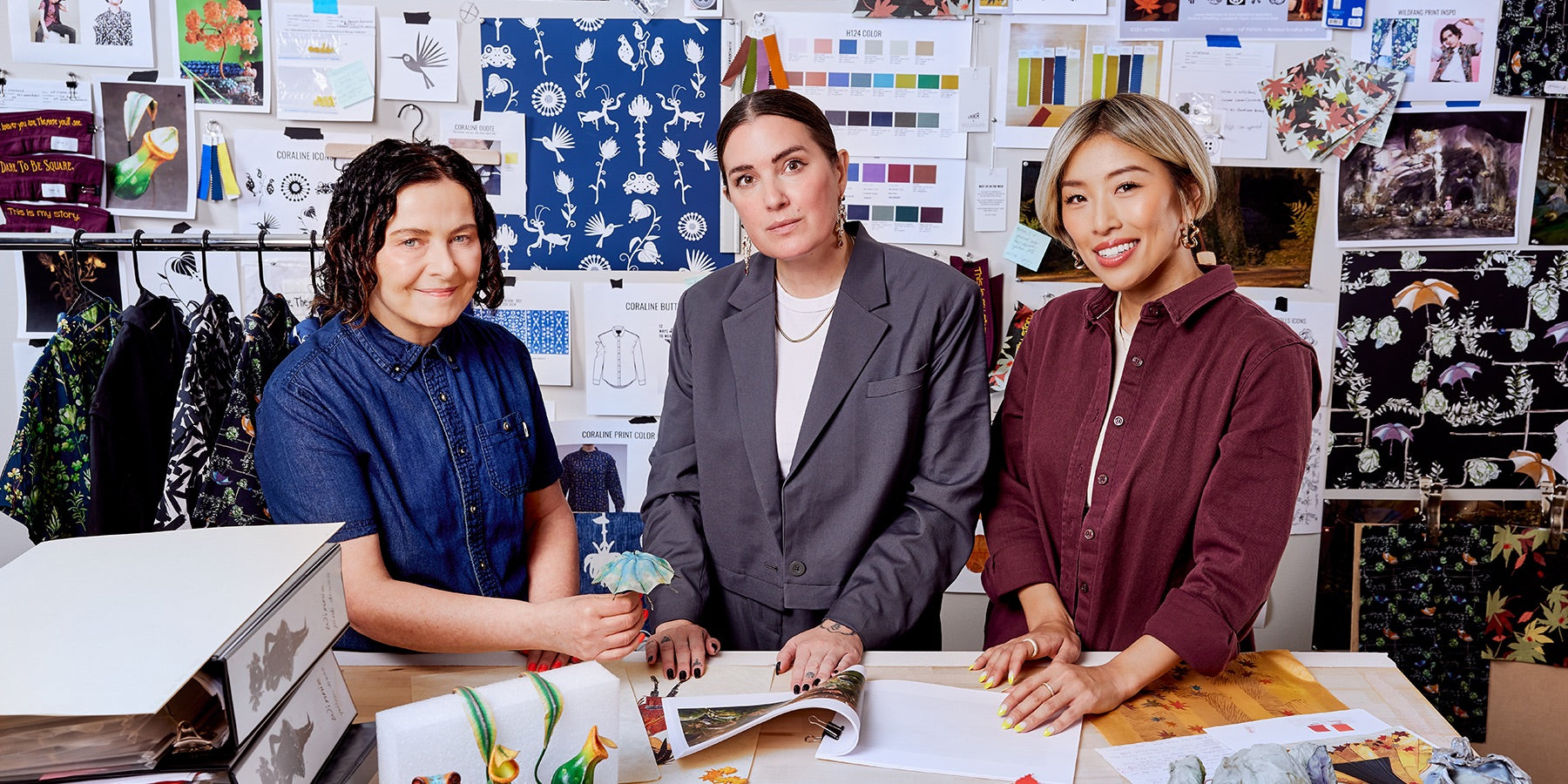 Picture of Laika and Wildfang team members Deb Cook, Taralyn Thuot
Yoshie Kurkowski in front of mood board inspiring Laika x Wildfang collection.