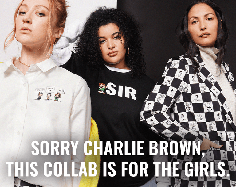 Three people stand in front of black and white background wearing pieces from the PEANUTS X WILDFANG collection. Text overlay centered at bottom of image reads "Sorry Charlie Brown, this collab is for the girls"