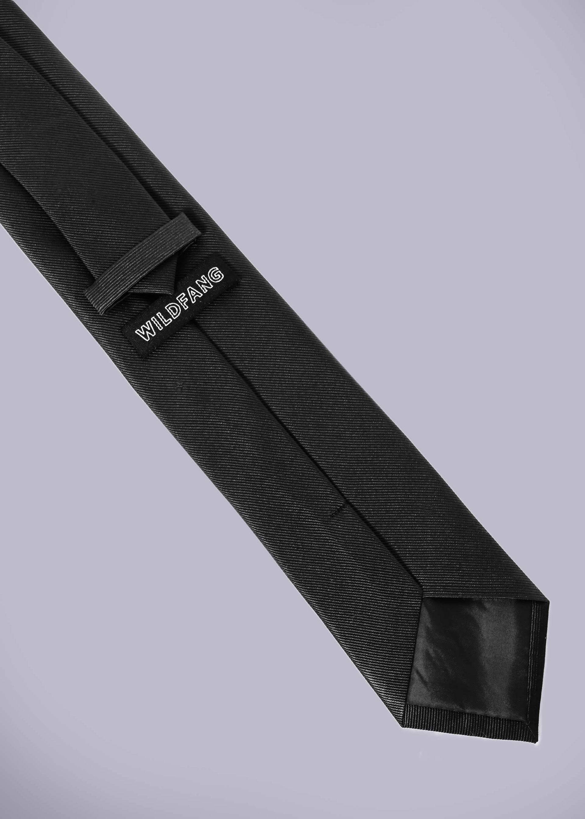 Back of black tie on white background showing WILDFANG label.