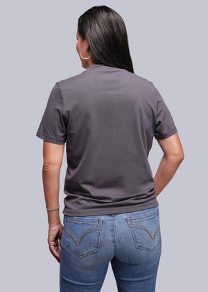 S=Person wearing a gray t-shirt and blue jeans on a plain background
