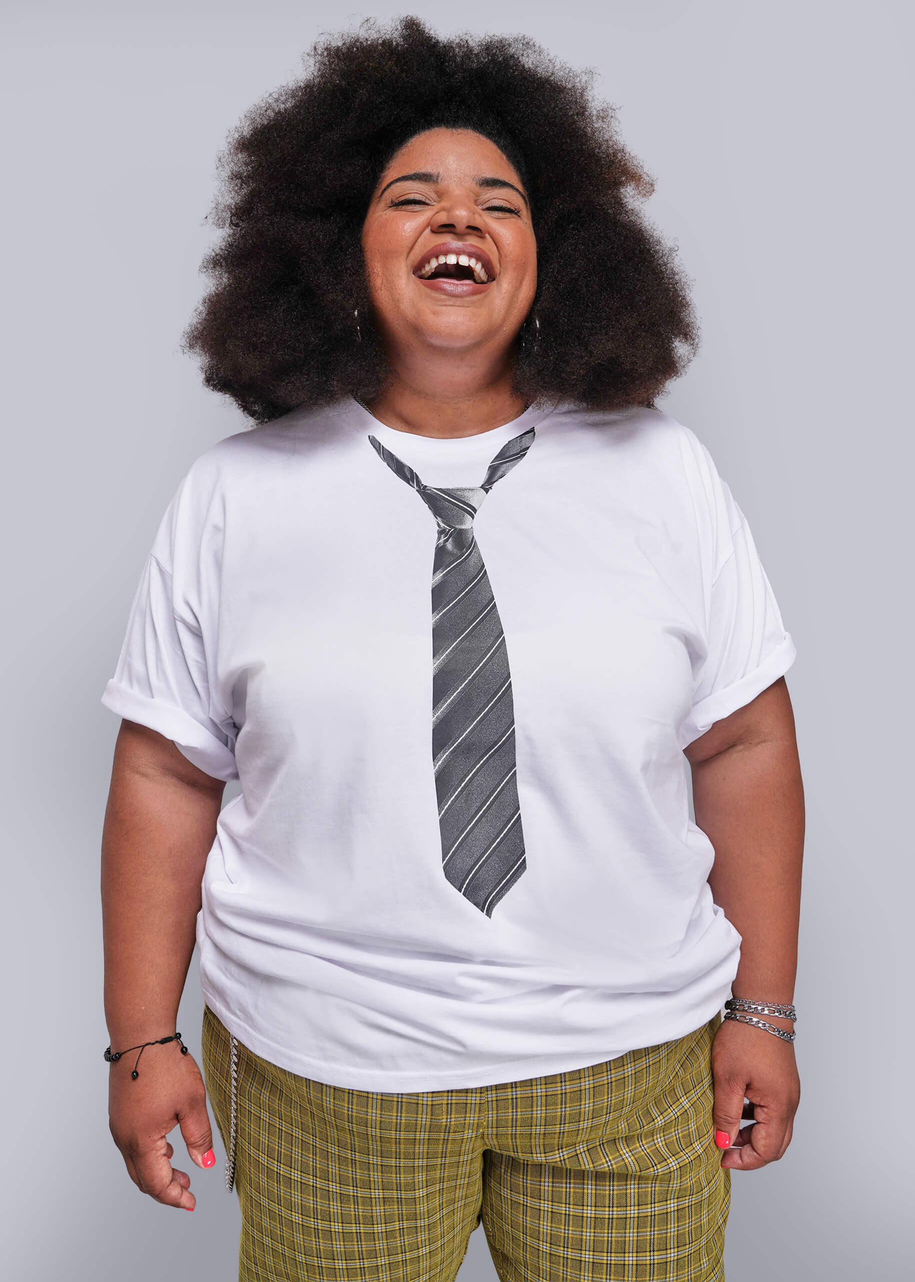 1X=Person wearing a white t-shirt with a tie design on a plain background