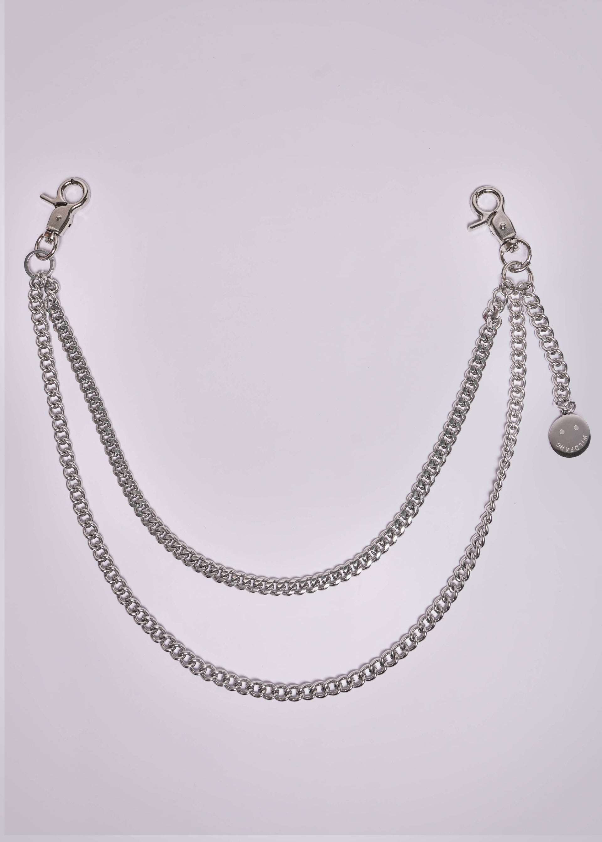 Silver chain accessory on a light gray background