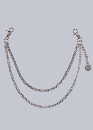 Silver chain accessory on a light gray background