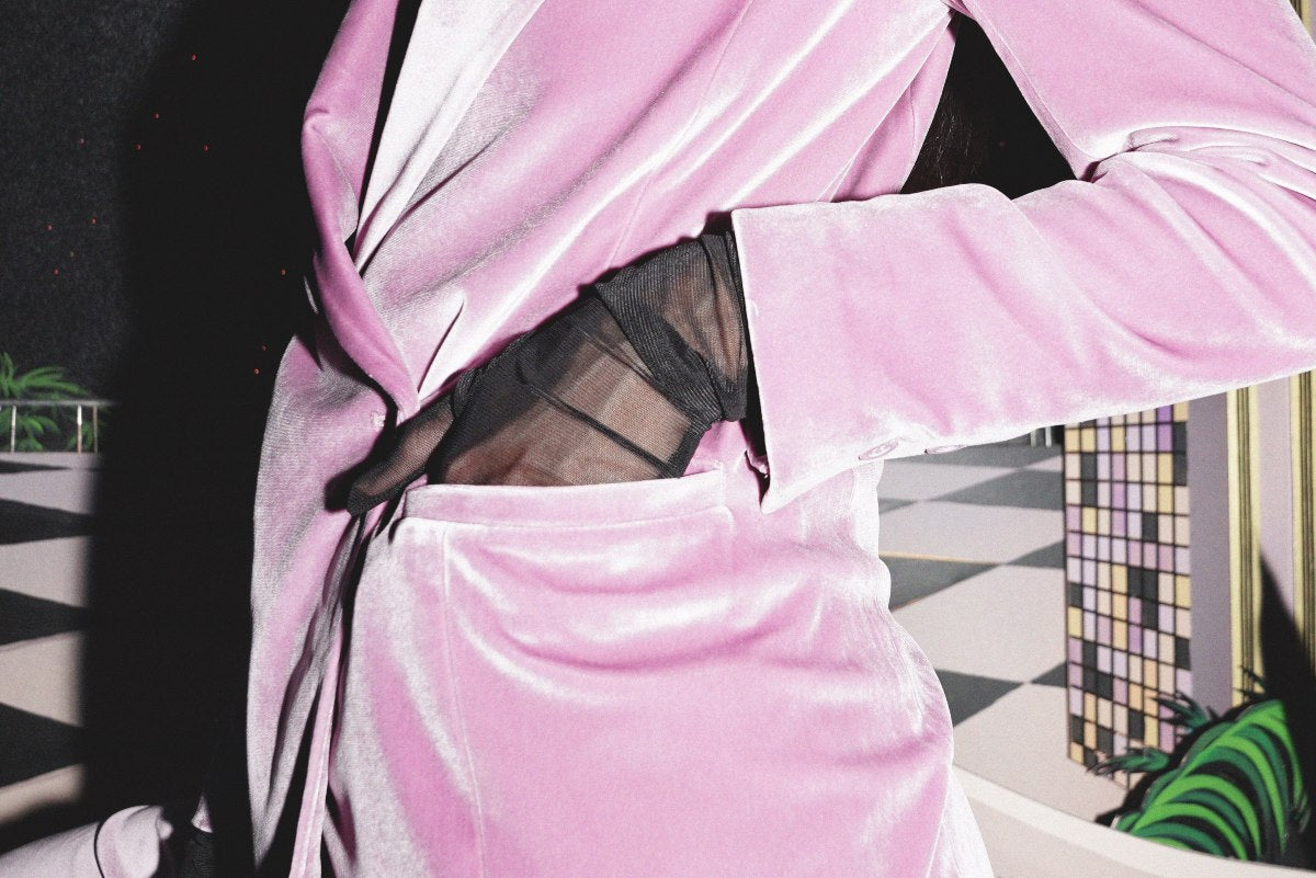 Pink velvet blazer with hand in pocket
