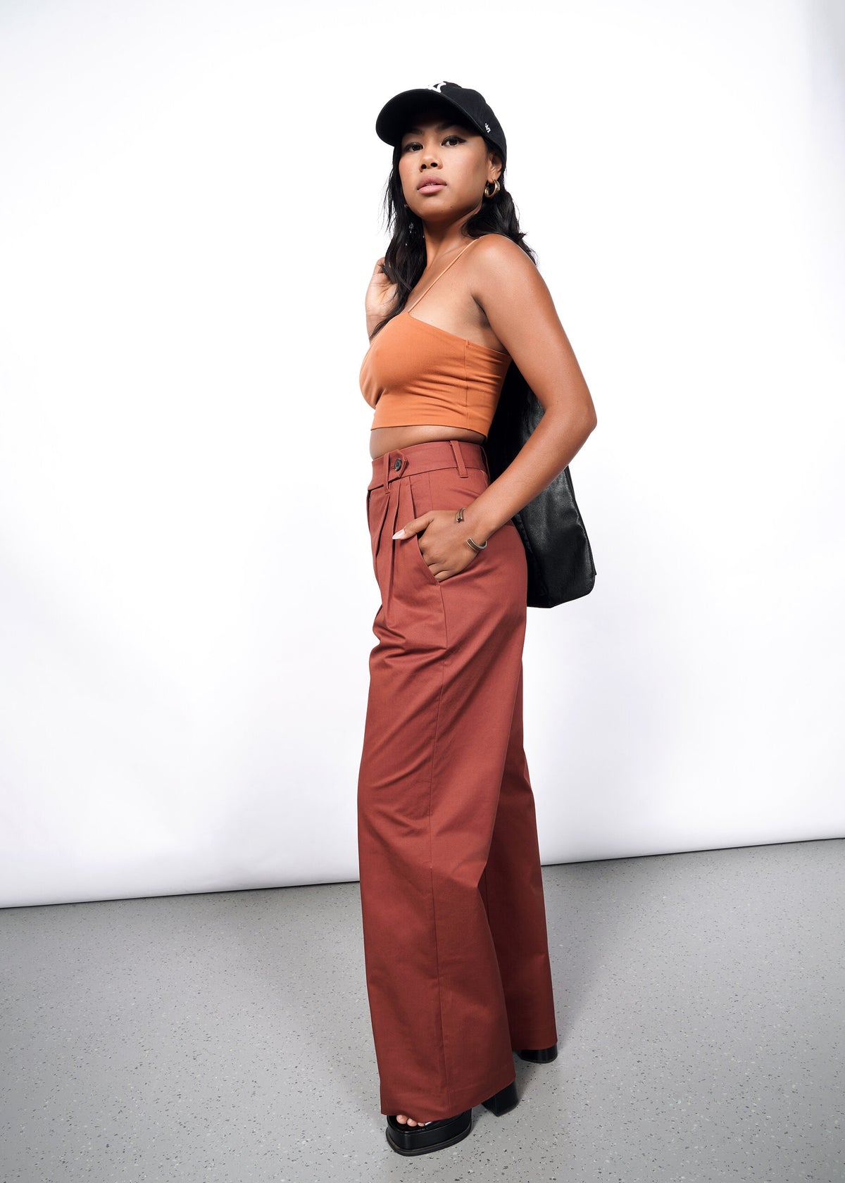 Model wearing The Essential Wide Leg Trouser in Cinnamon