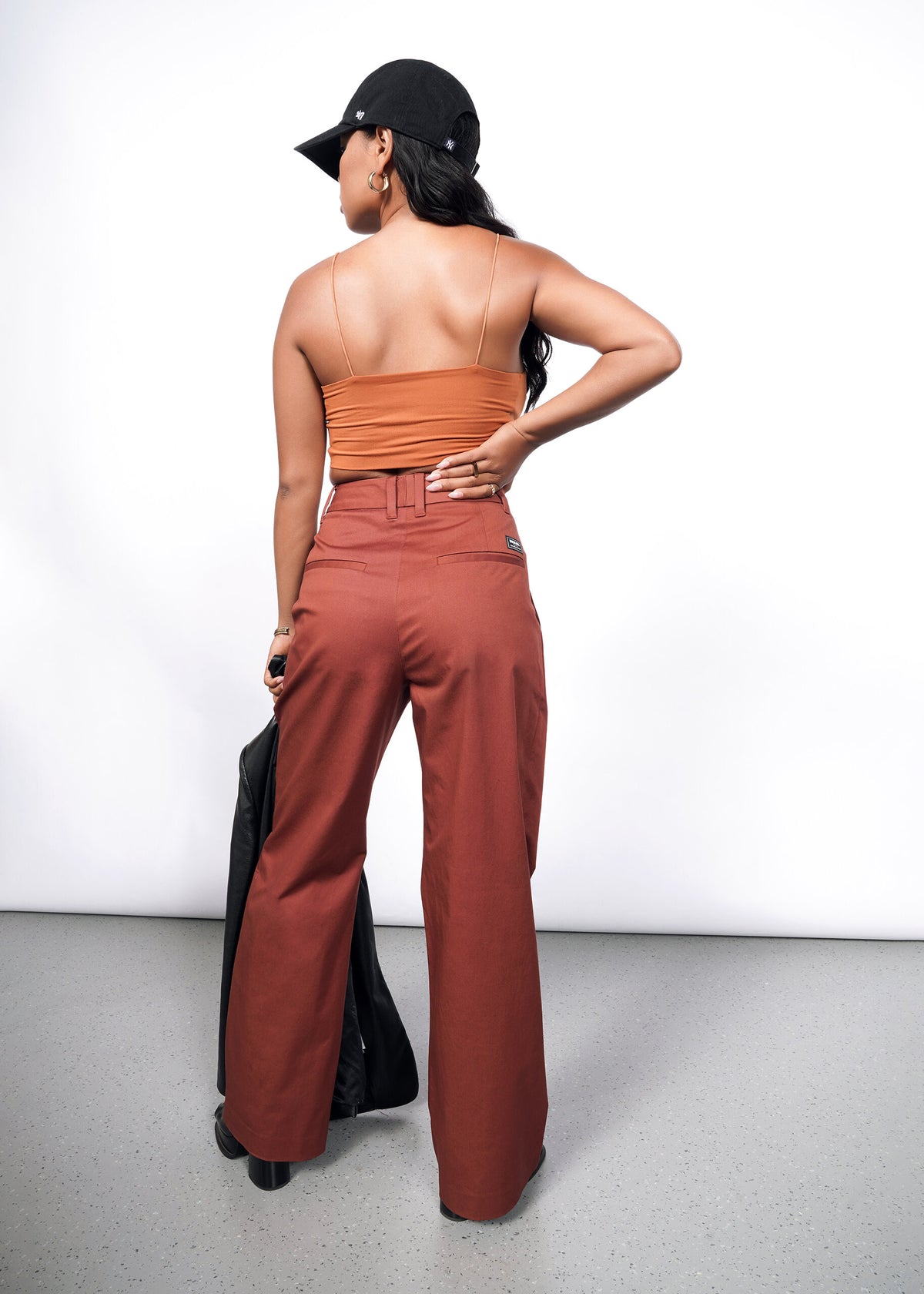 Model wearing The Essential Wide Leg Trouser in Cinnamon