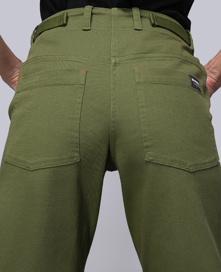 Close up image of back of denim utility pant.