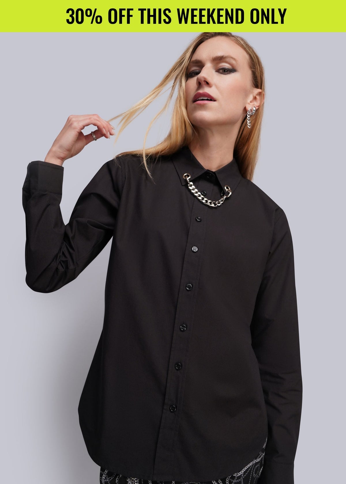 Person wearing long sleeve black button up shirt with chain detail at collar.Promotional banner on top of image reads 30% OFF THIS WEEKEND ONLY