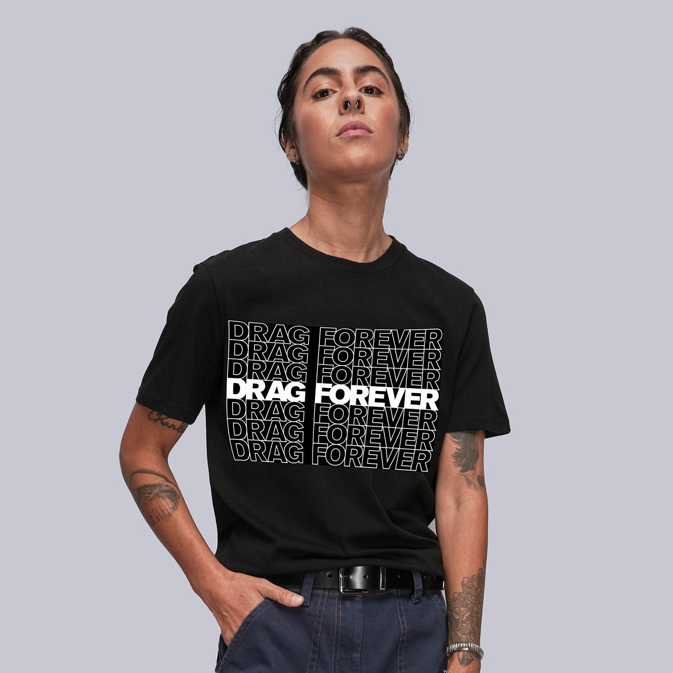 Person wearing a black t-shirt with 'DRAG FOREVER' text on a plain background