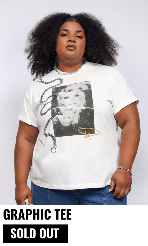 Model with curly black hair looks at camera wearing jeans and The Debbie Harry x Wildfang Graphic Tee. Text underneath image reads GRAPHIC TEE $45 and button underneath reads SOLD OUT.