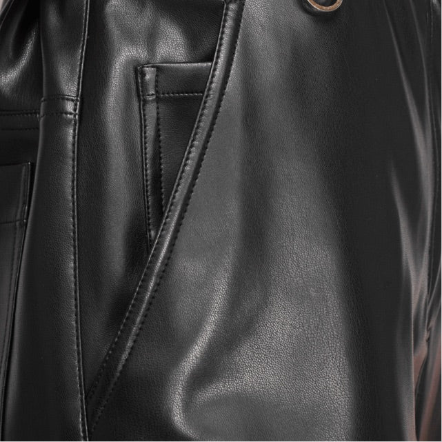 Close-up of a black leather with a pocket 