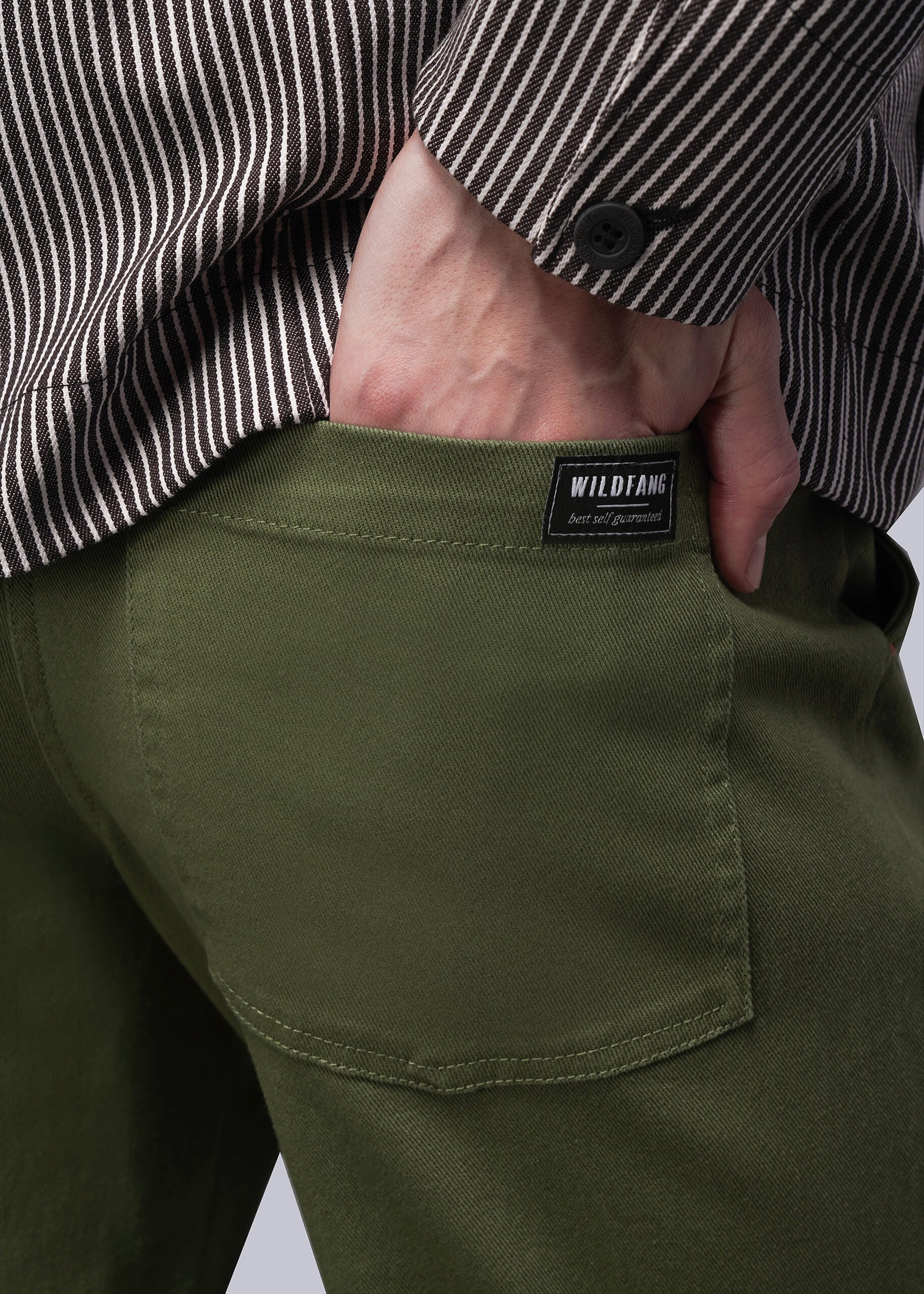 S=Green pants with a visible brand label against a neutral background