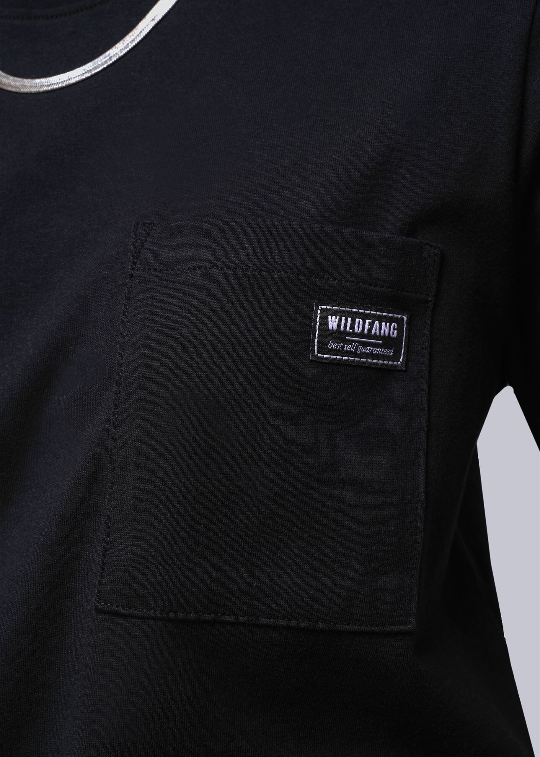 Black t-shirt with a visible brand label on the chest pocket against a white background
