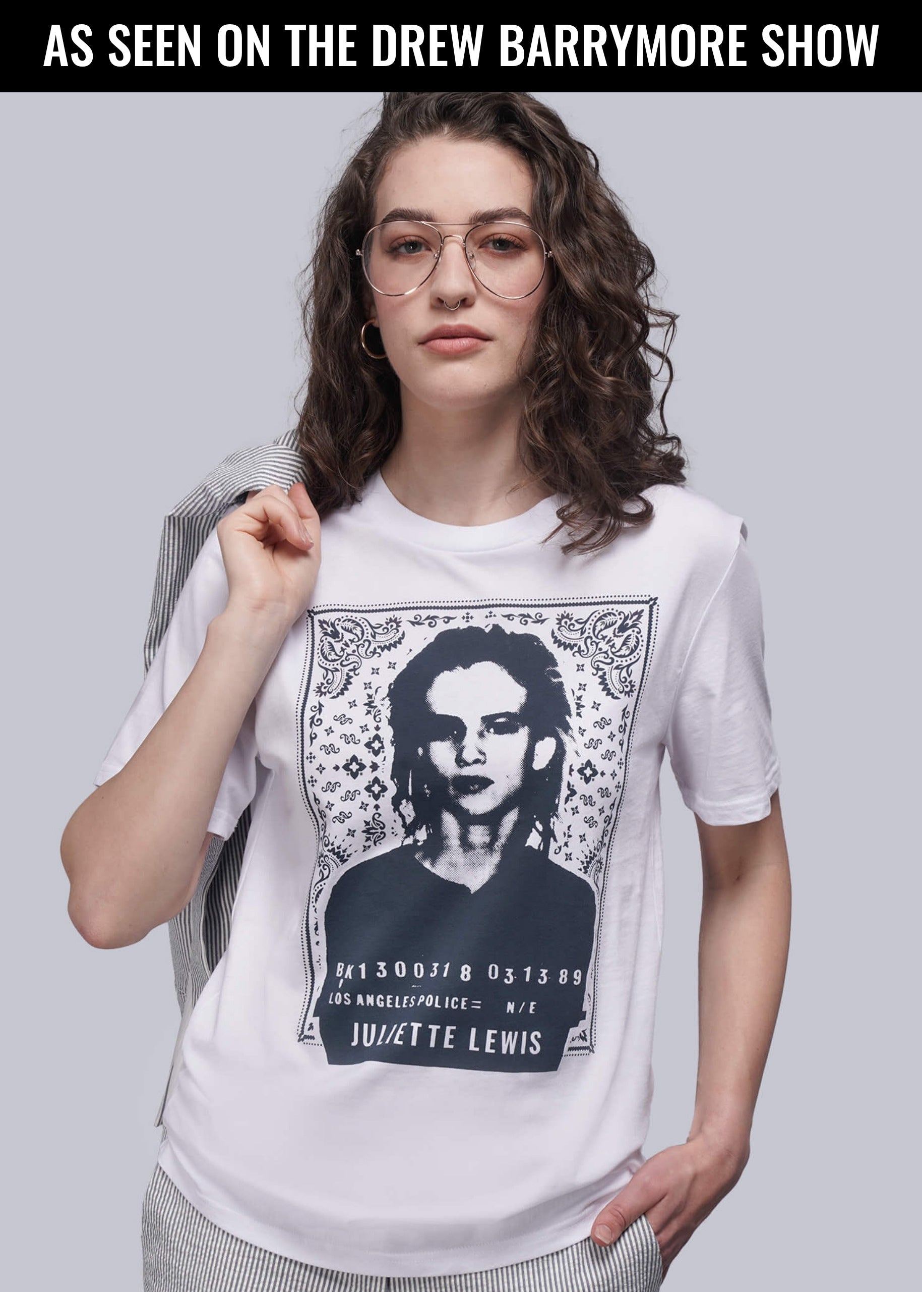 Model wearing Juliette Lewis X Wildfang Bandit Tee with promotional copy at the top that reads "AS SEEN ON THE DREW BARRYMORE SHOW"