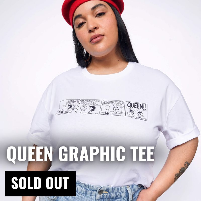 Person wearing white tee with graphic. Text overlay reads QUEEN GRAPHIC TEE, and in black box below text says SOLD OUT.