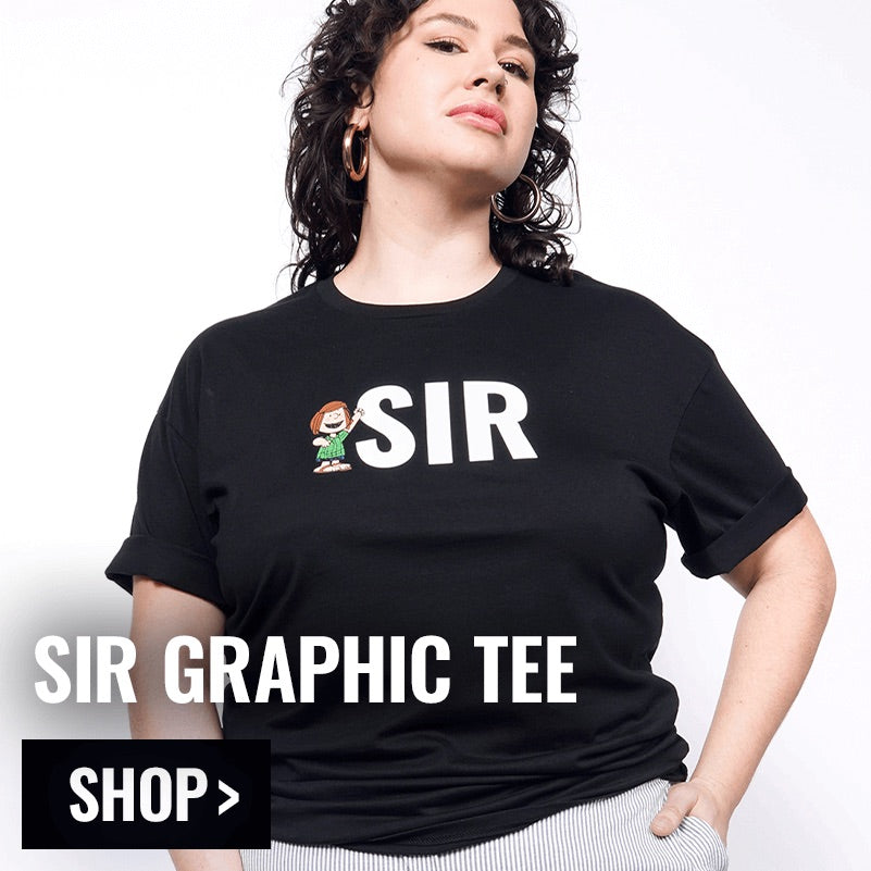 Person modeling the PEANUTS X WILDFANG Sir Graphic Tee with overlay text in bottom left corner that reads SIR GRAPHIC TEE and button that reads SHOP.