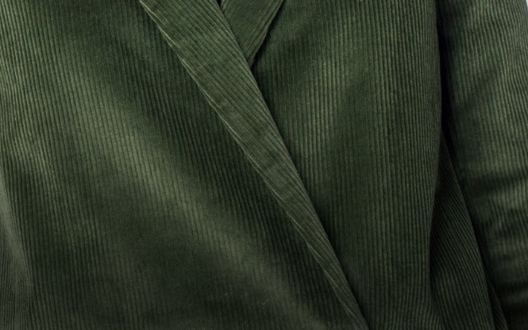 Close up of green corduroy blazer