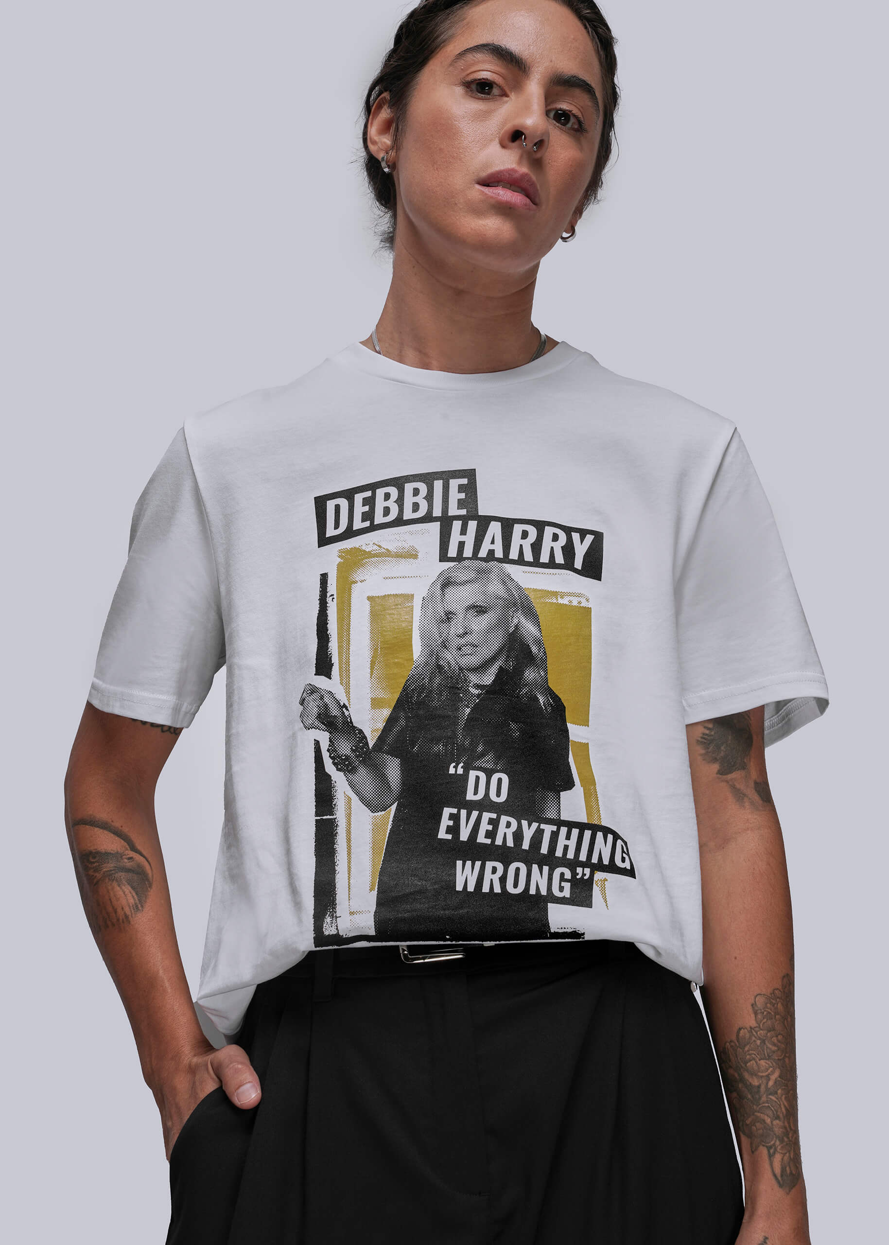 Person wearing a t-shirt with a graphic of Debbie Harry and text on a plain background