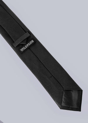 Back of black tie on white background showing WILDFANG label.