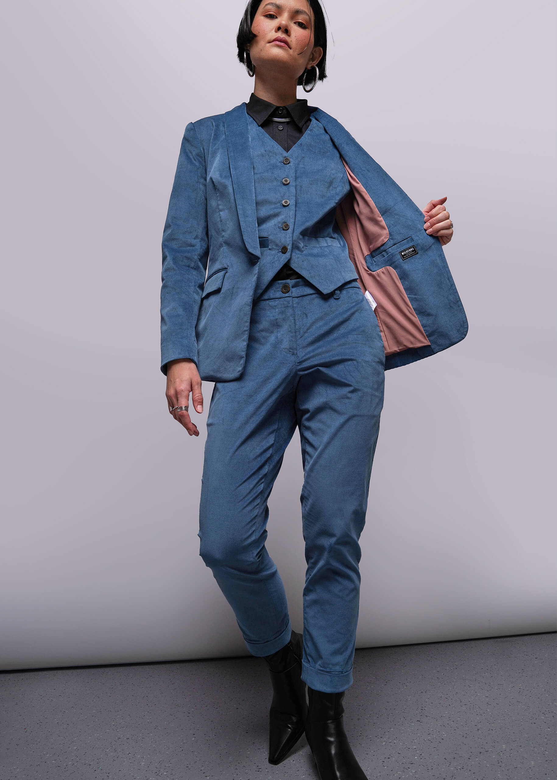 Person wearing a blue suit with a white background