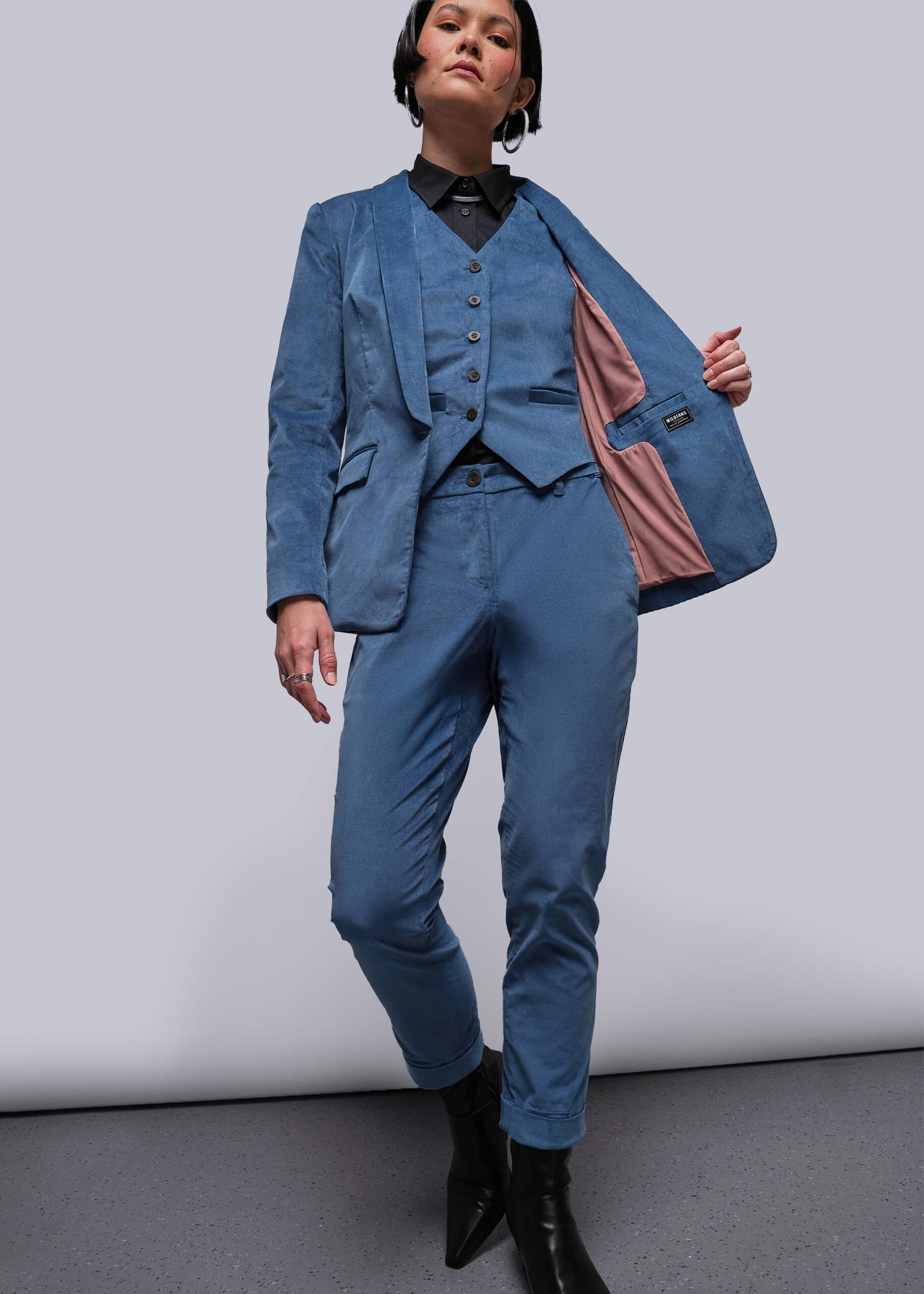 Person wearing a blue suit with a white background