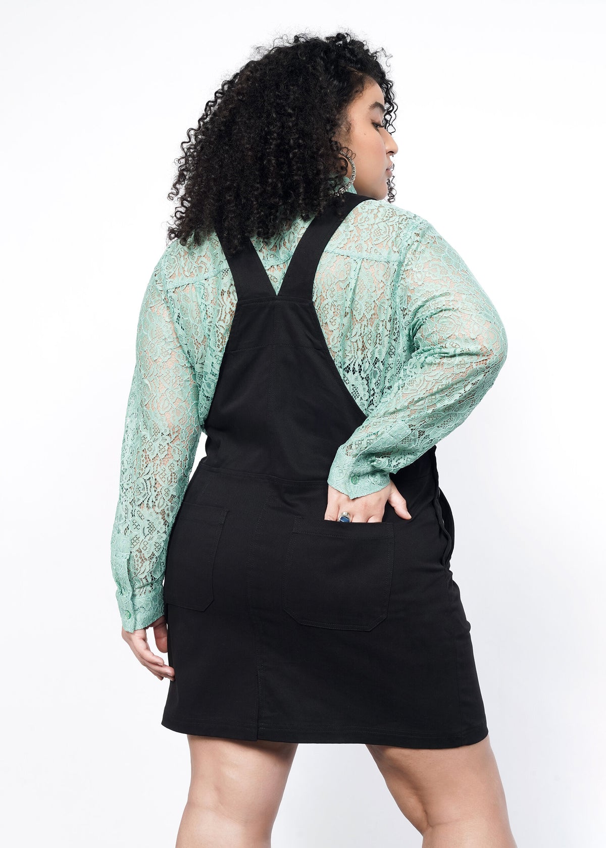 Back image of Model wearing the Essential Skirtall in Black size XL, with a Long Sleeve Lace Button Up in Sage