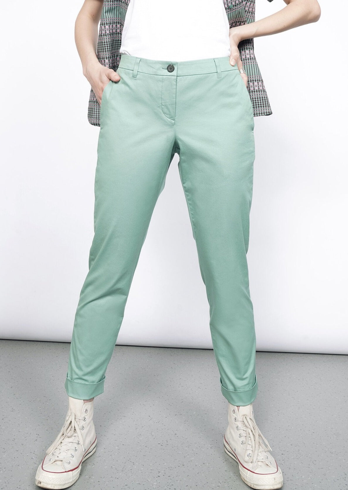 Model wearing the Essential Trouser in Sage in size 4, with a white T and the Essential Button Up in Gingham Sage