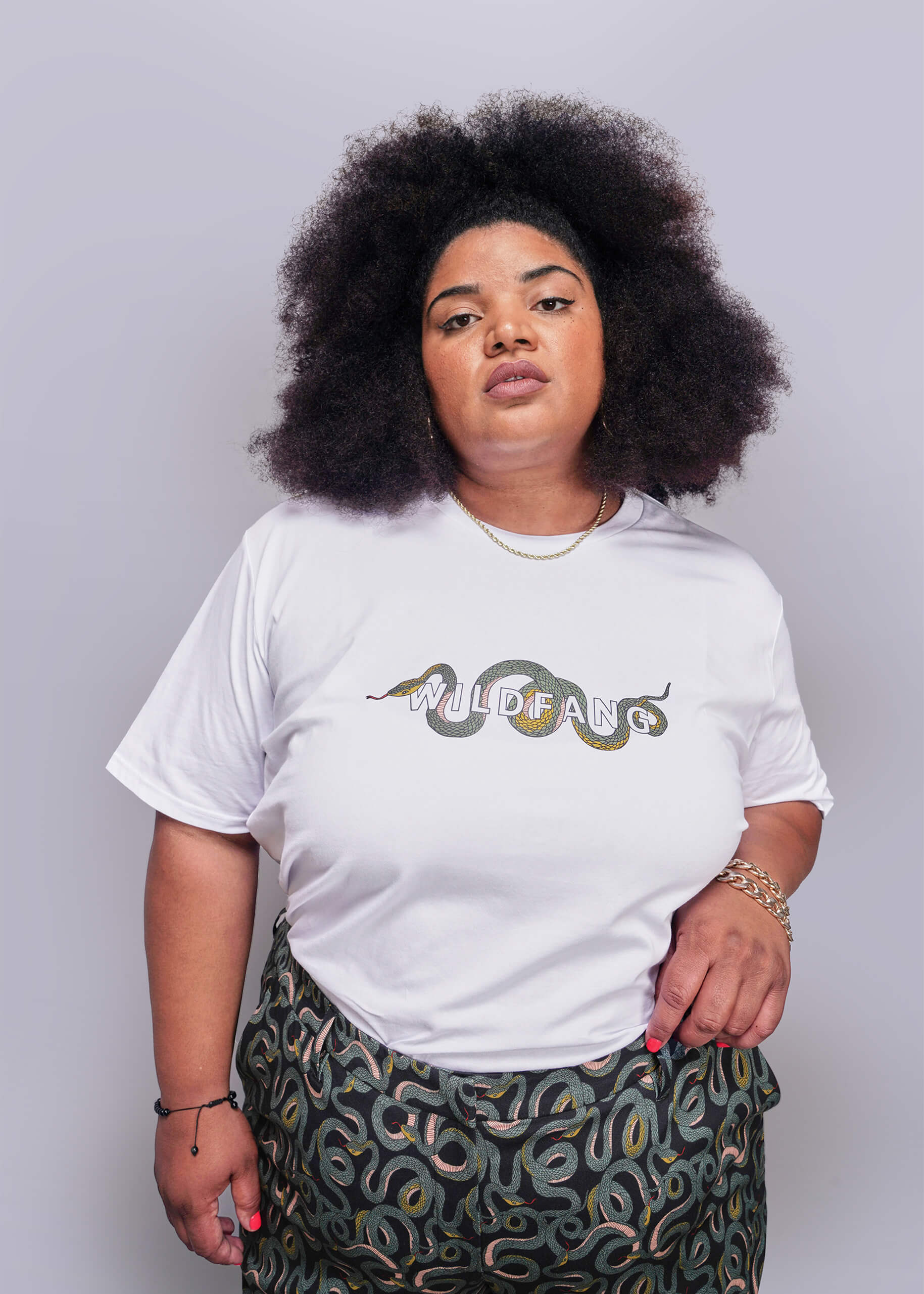 1X=Person wearing a white t-shirt with 'WILDFANG' design on a plain background