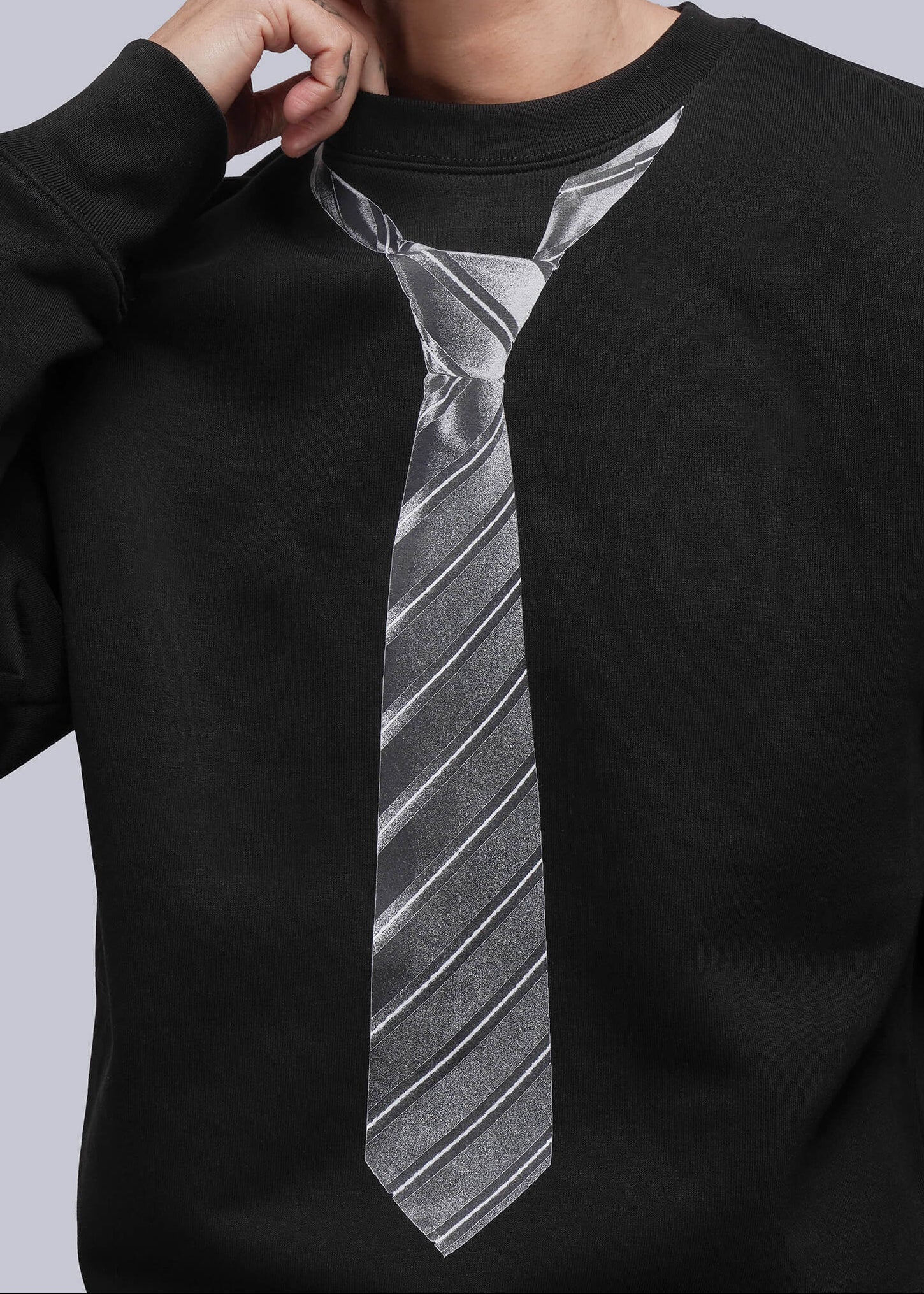 Black sweatshirt with a grey tie design on a plain background