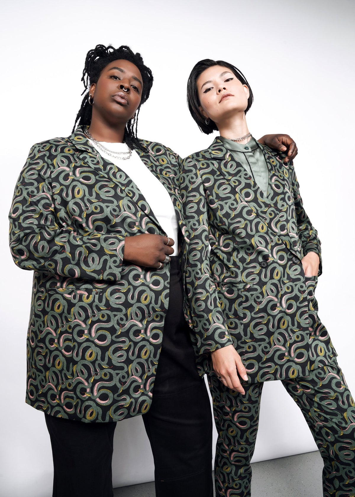 2 Models wearing the The Empower Double Breasted Blazer in Serpentine Black