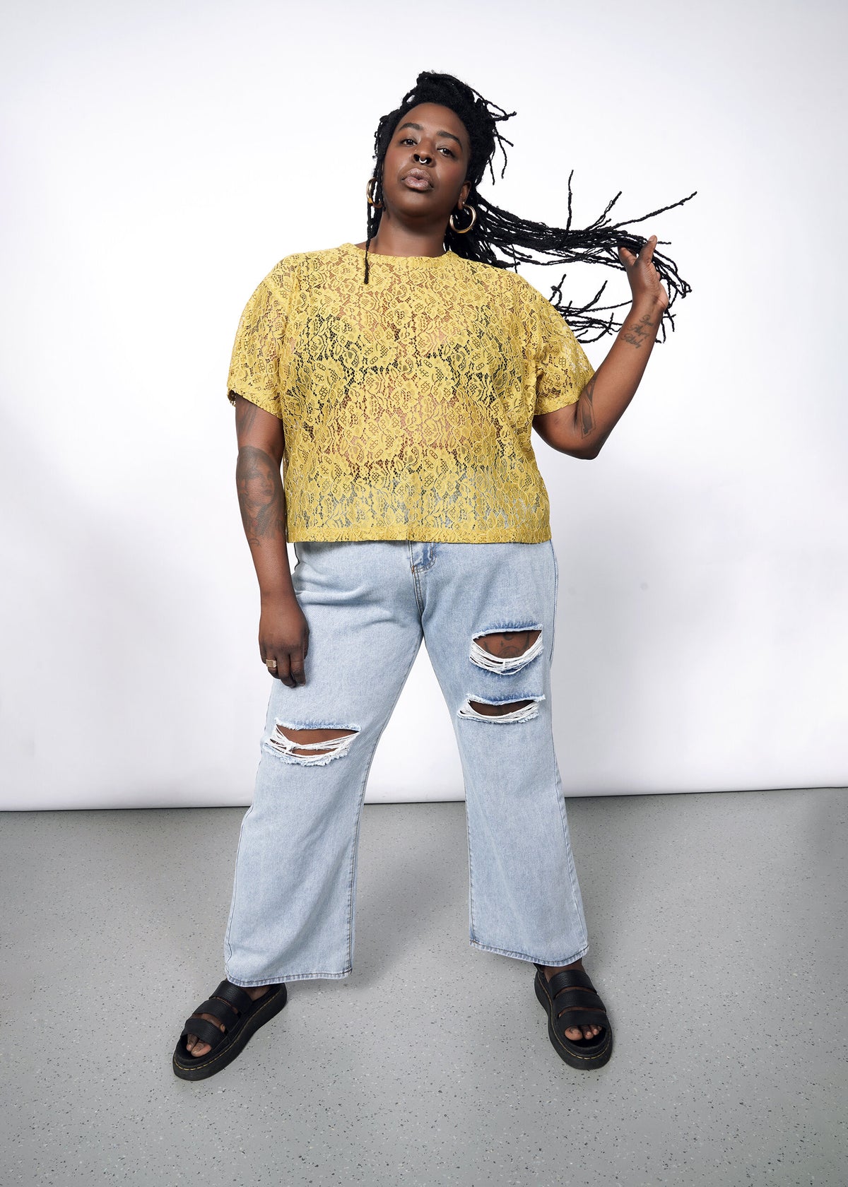 Model wearing The Empower Lace Boxy Blouse in Dijon