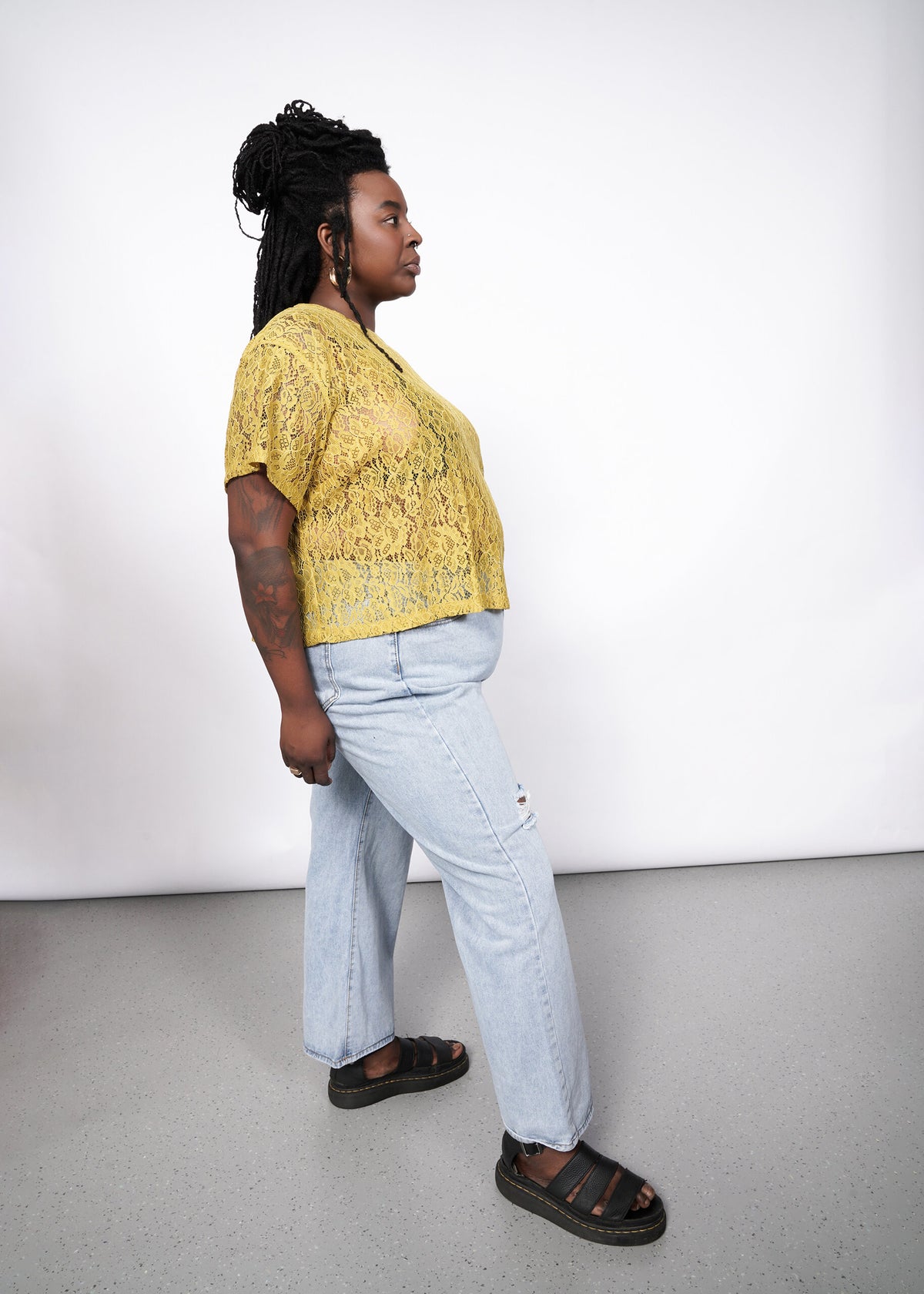 Model wearing The Empower Lace Boxy Blouse in Dijon