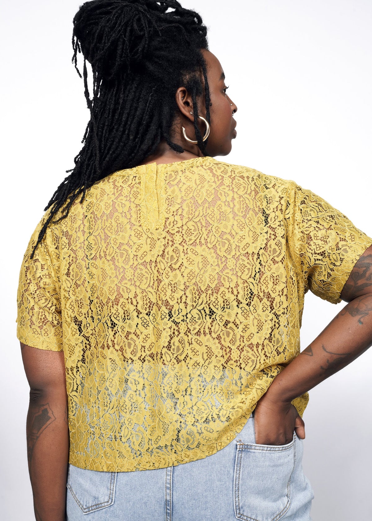 Model wearing The Empower Lace Boxy Blouse in Dijon