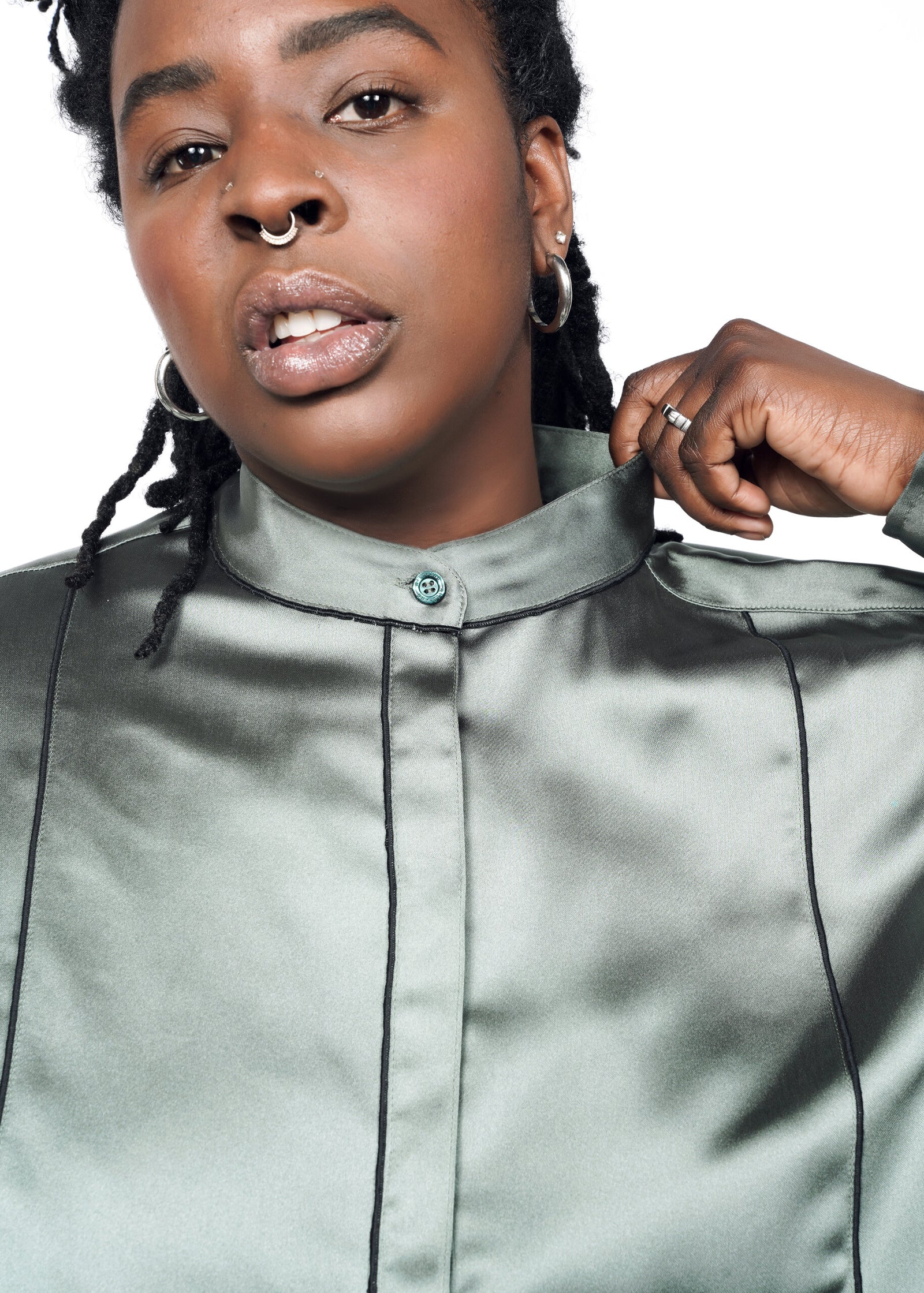 Model wearing The Empower Satin Long Sleeve Tuxedo Button Up in Ivy