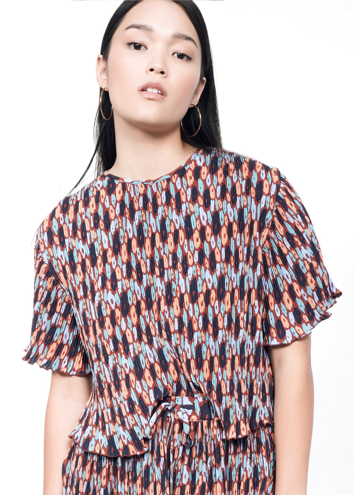 Model wearing The Empower Plisse Boxy Blouse