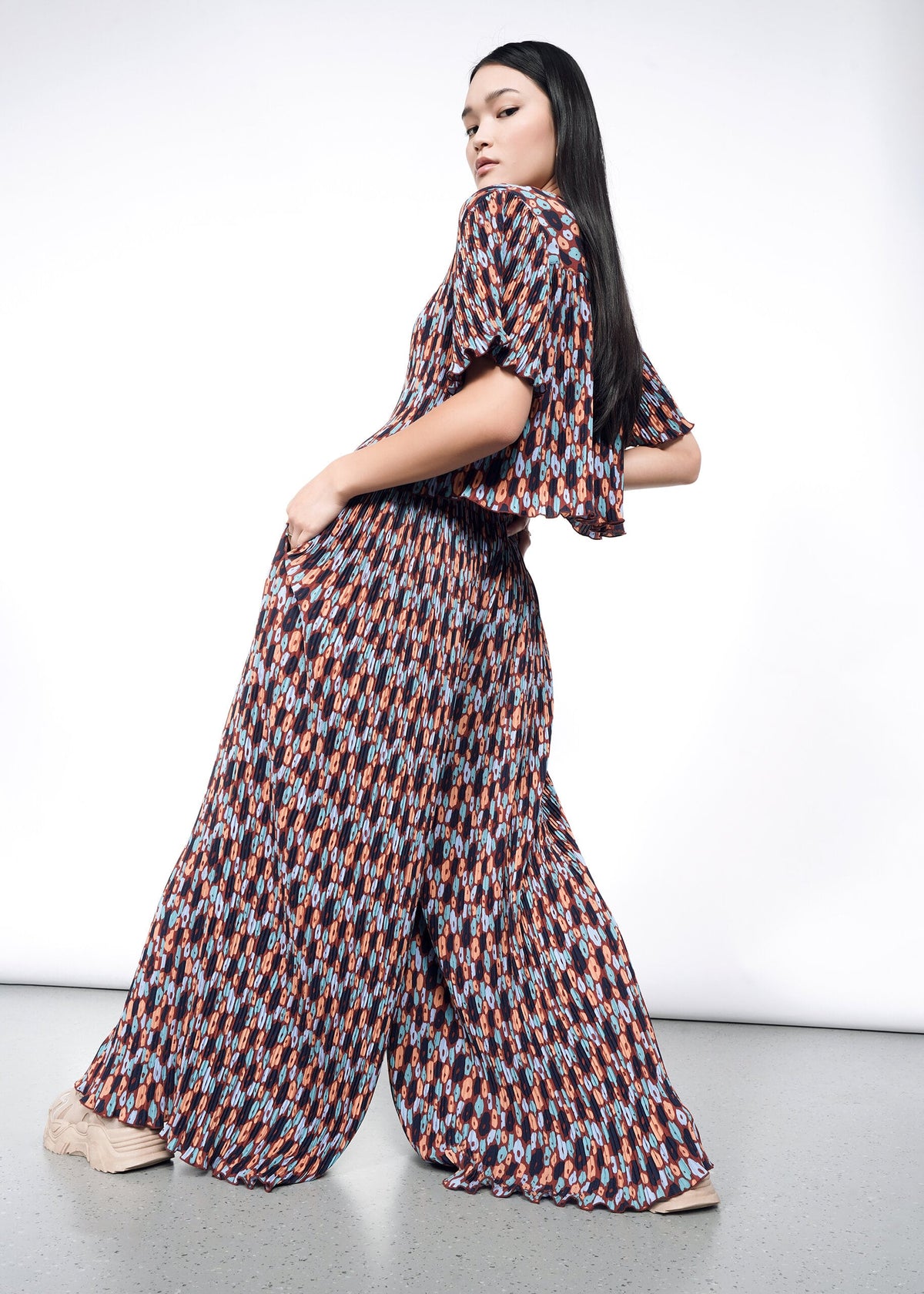 Model wearing The Empower Plisse Boxy Blouse