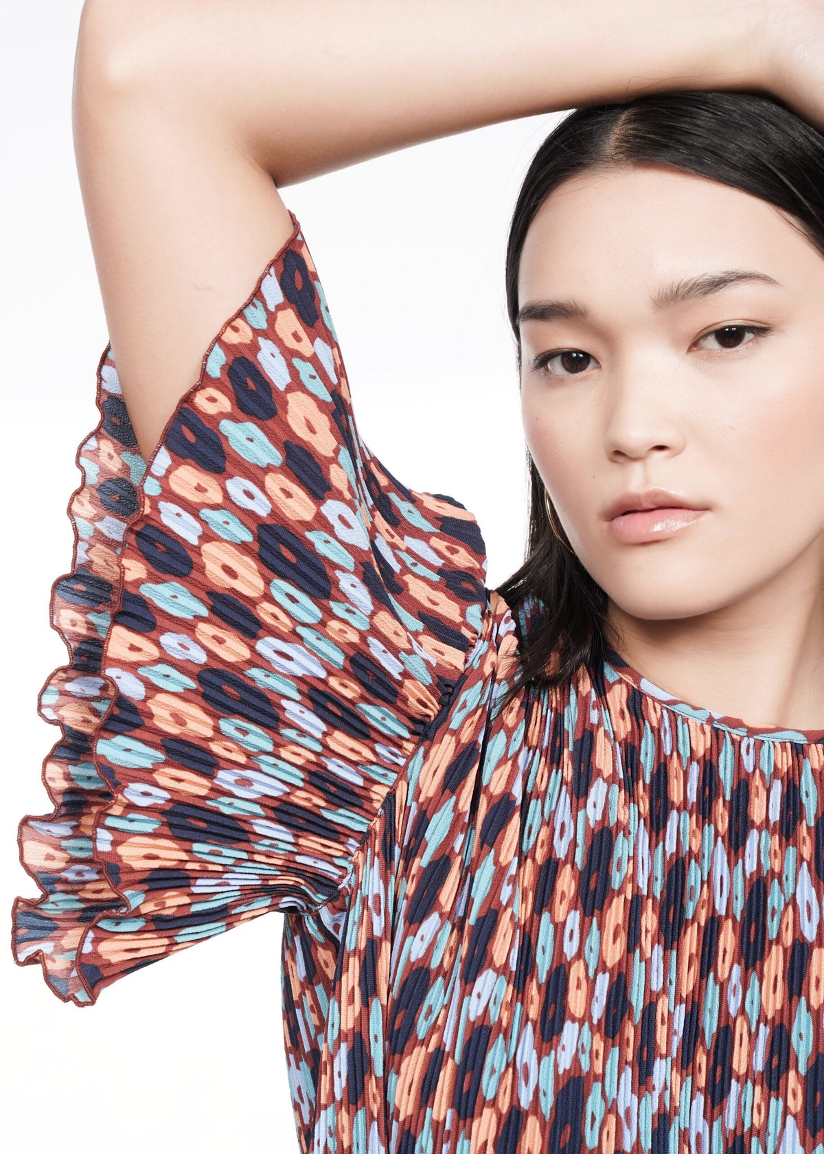 Closeup of The Empower Plisse Boxy Blouse