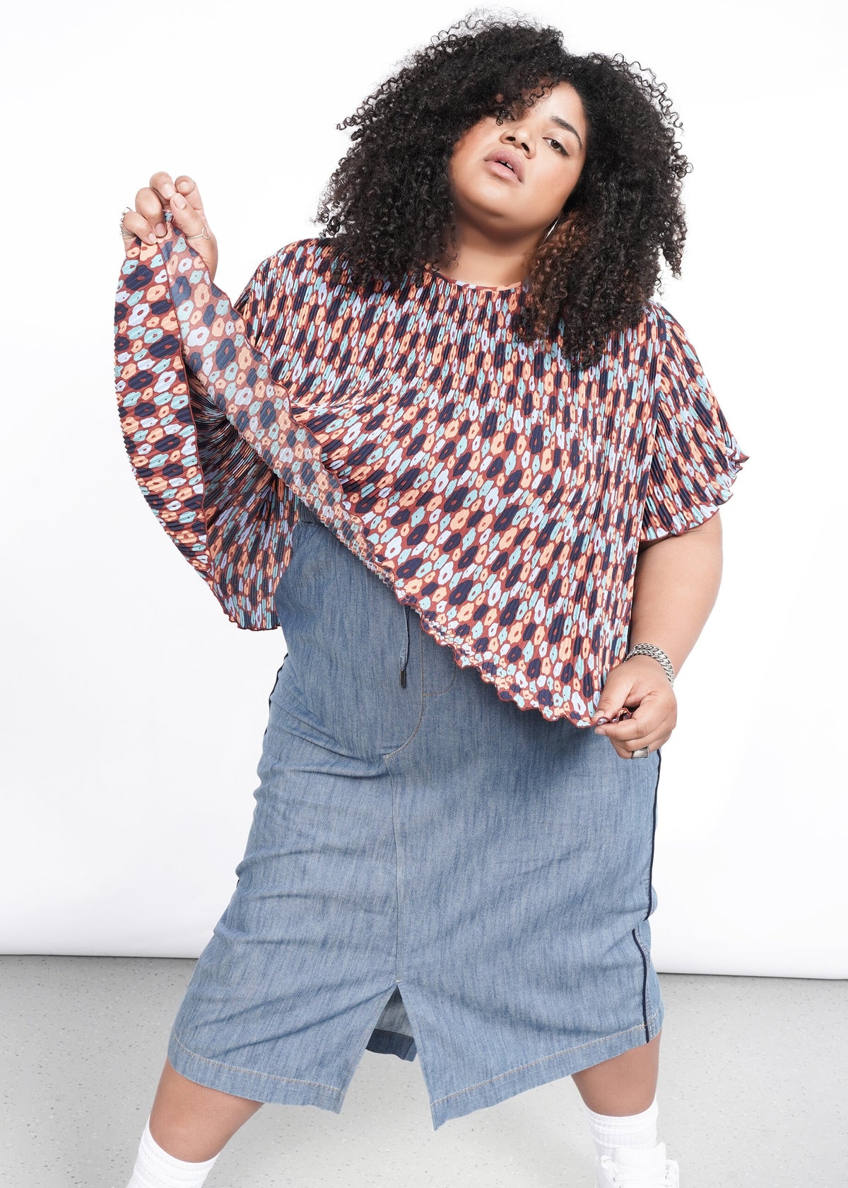 Model wearing The Empower Plisse Boxy Blouse