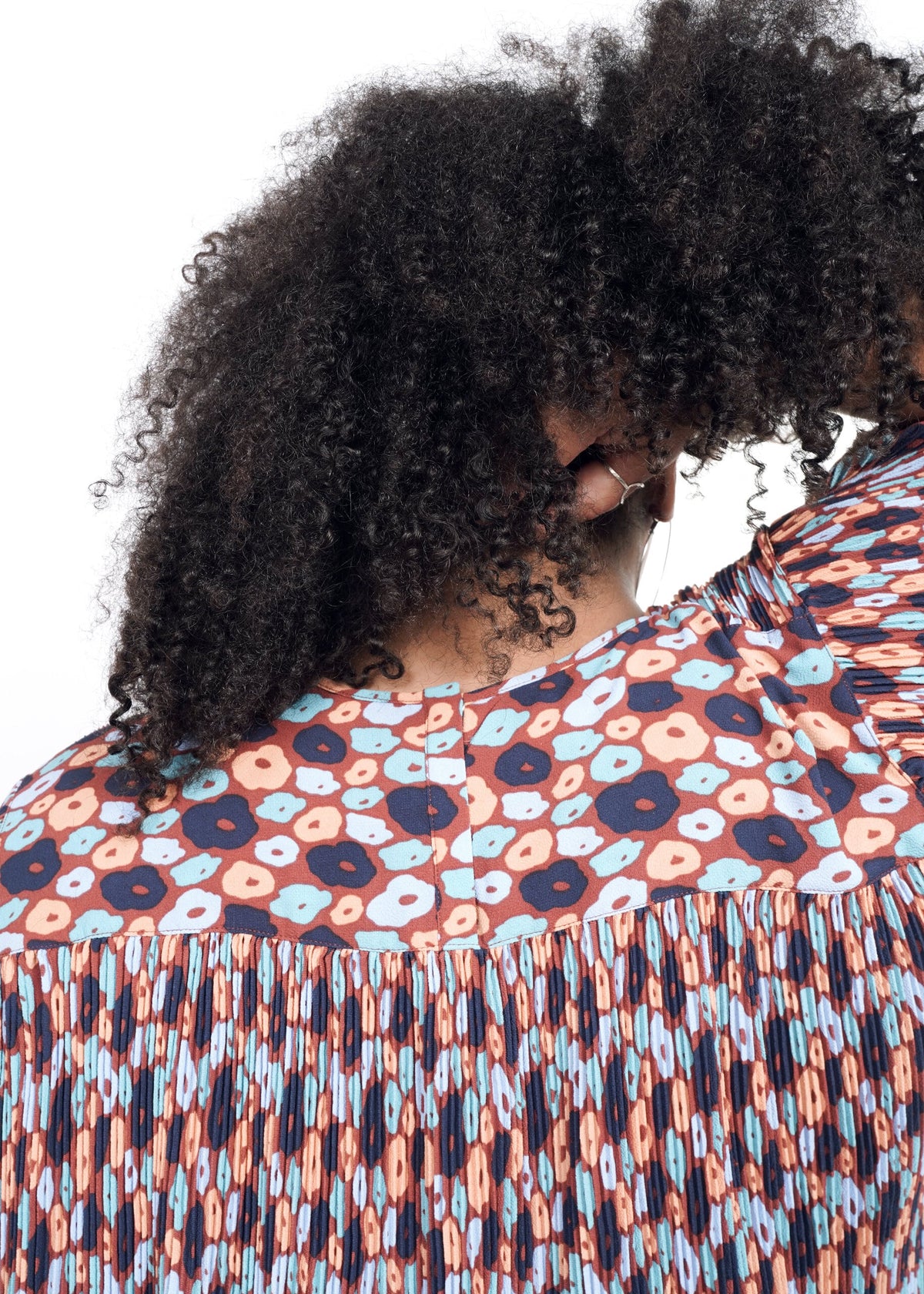 Closeup of The Empower Plisse Boxy Blouse