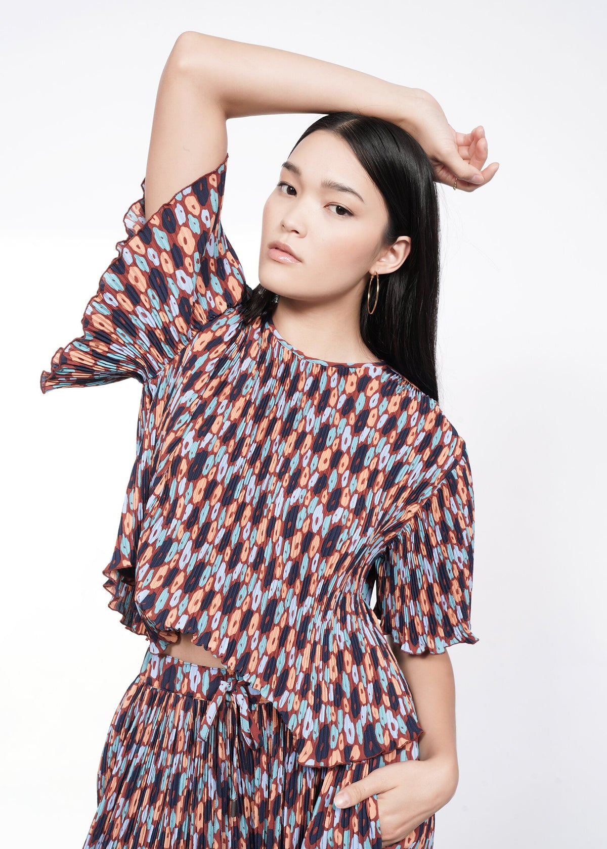 Model wearing The Empower Plisse Boxy Blouse
