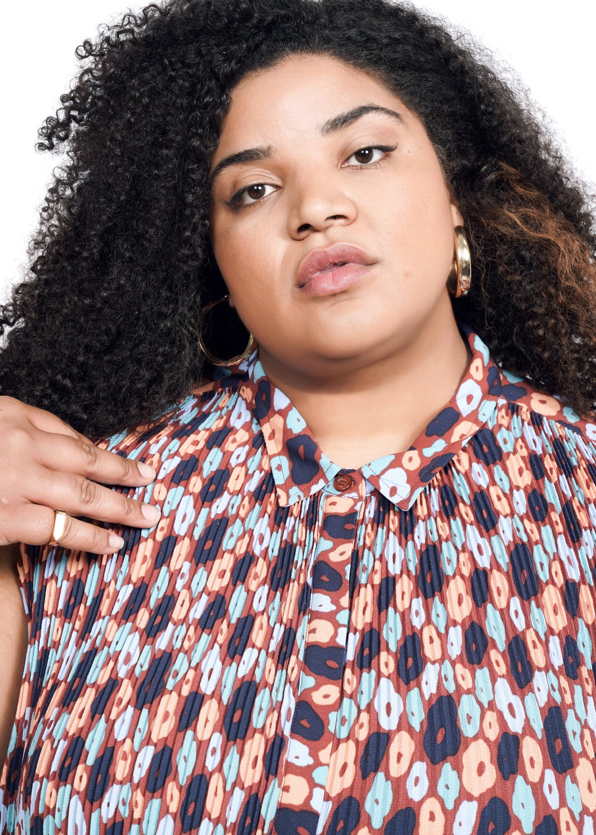 Closeup of The Empower Plisse Sleeveless Button Up