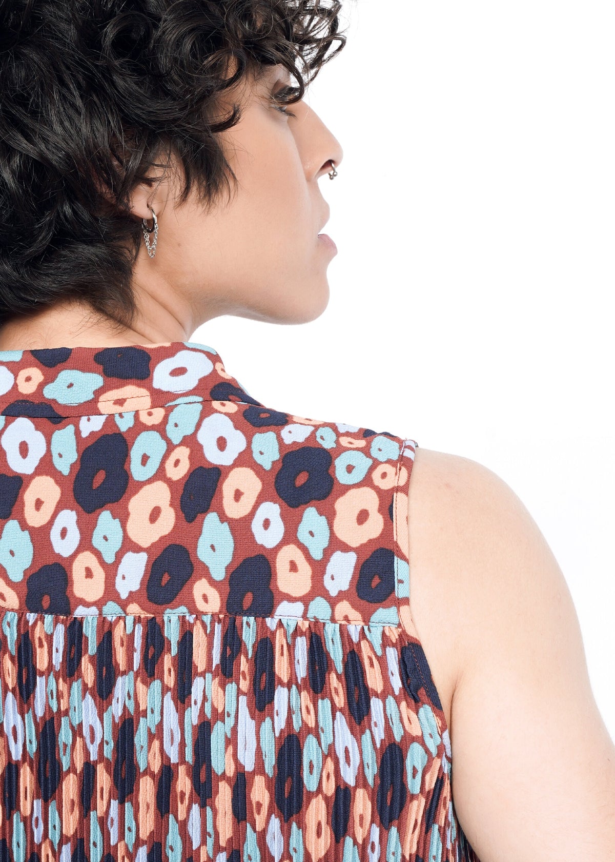 Closeup of The Empower Plisse Sleeveless Button Up