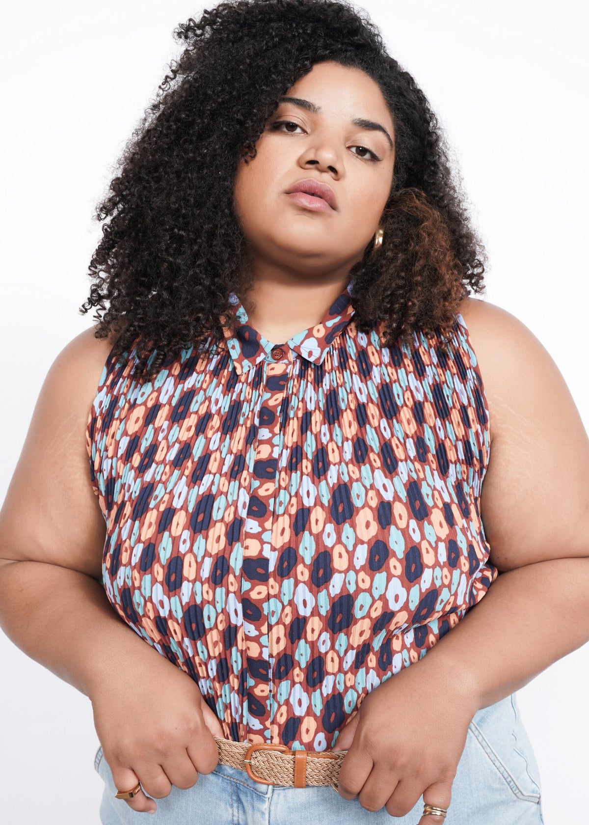 Model wearing The Empower Plisse Sleeveless Button Up