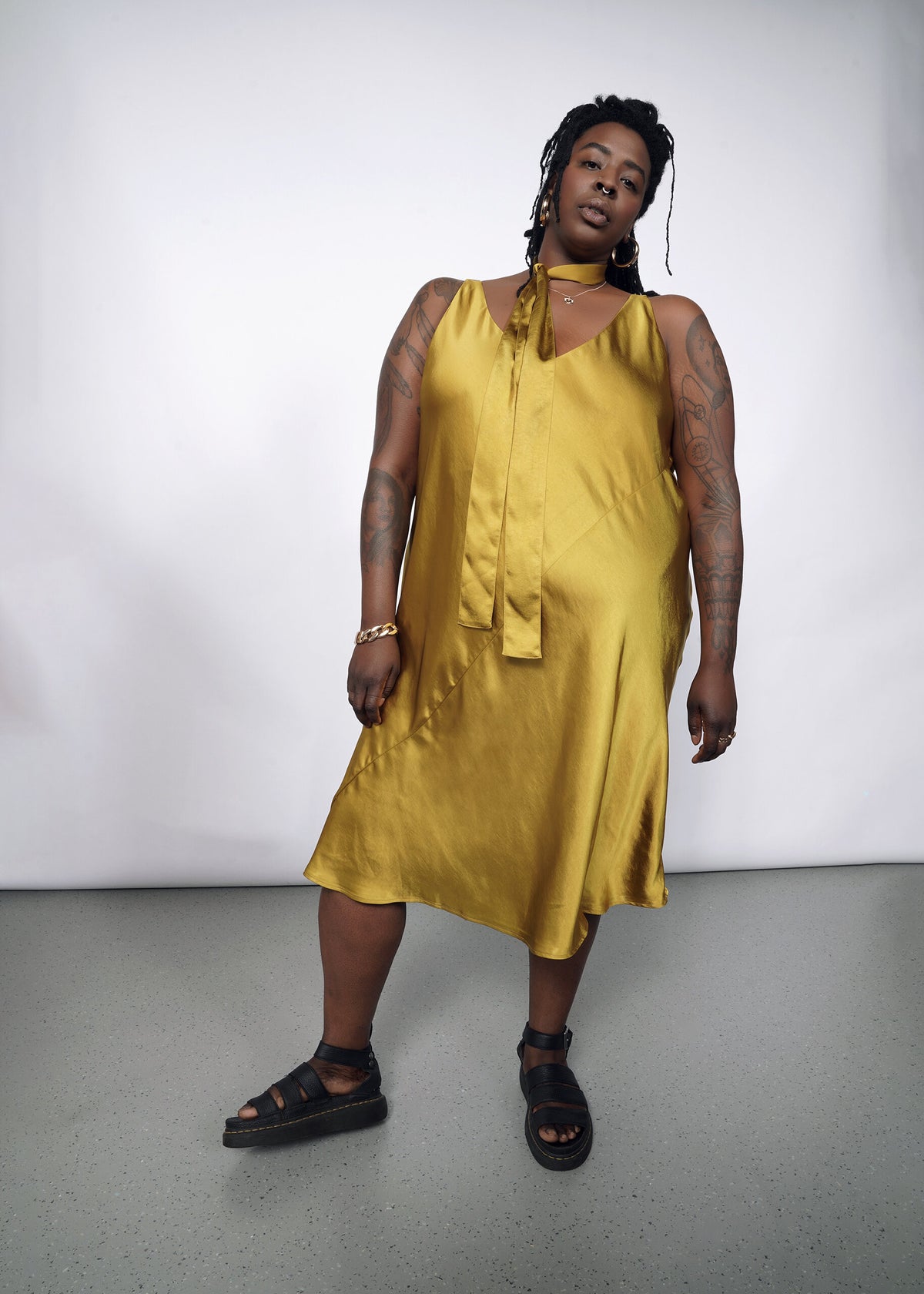 Model wearing The Empower Satin Adjustable Slip Dress in Dijon