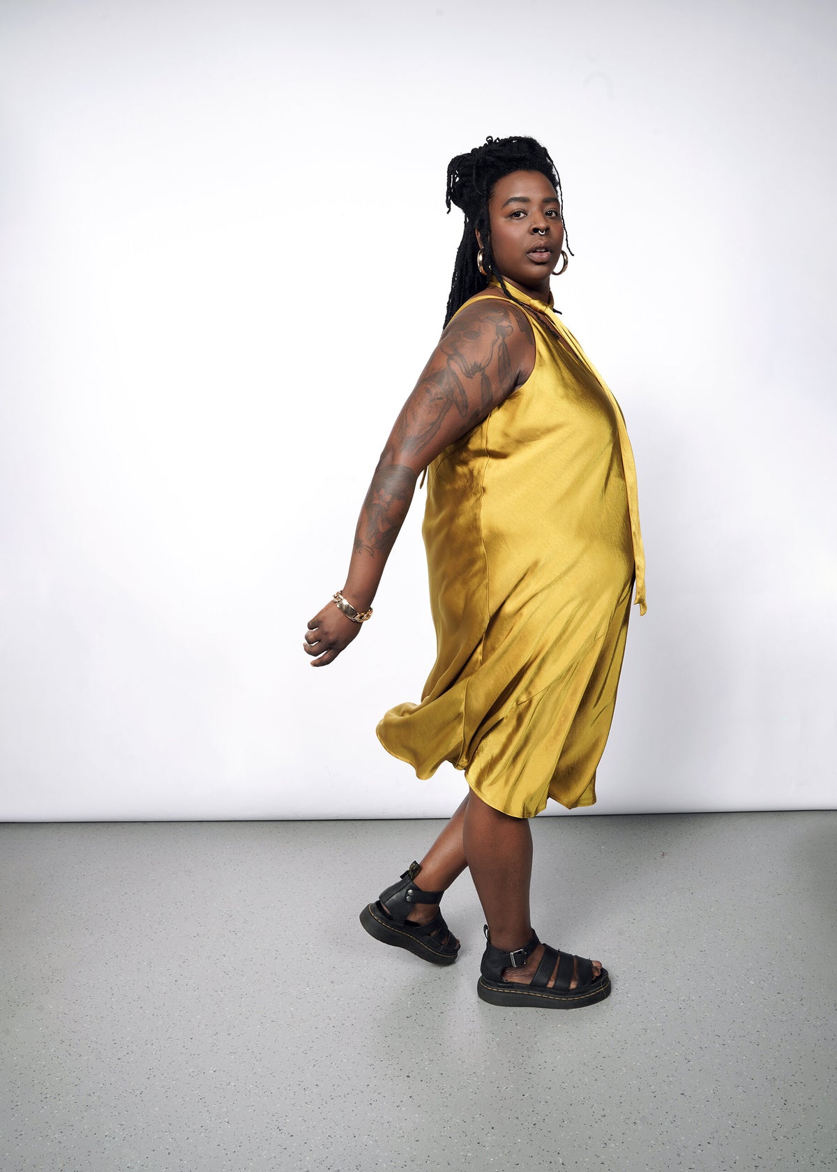 Model wearing The Empower Satin Adjustable Slip Dress in Dijon