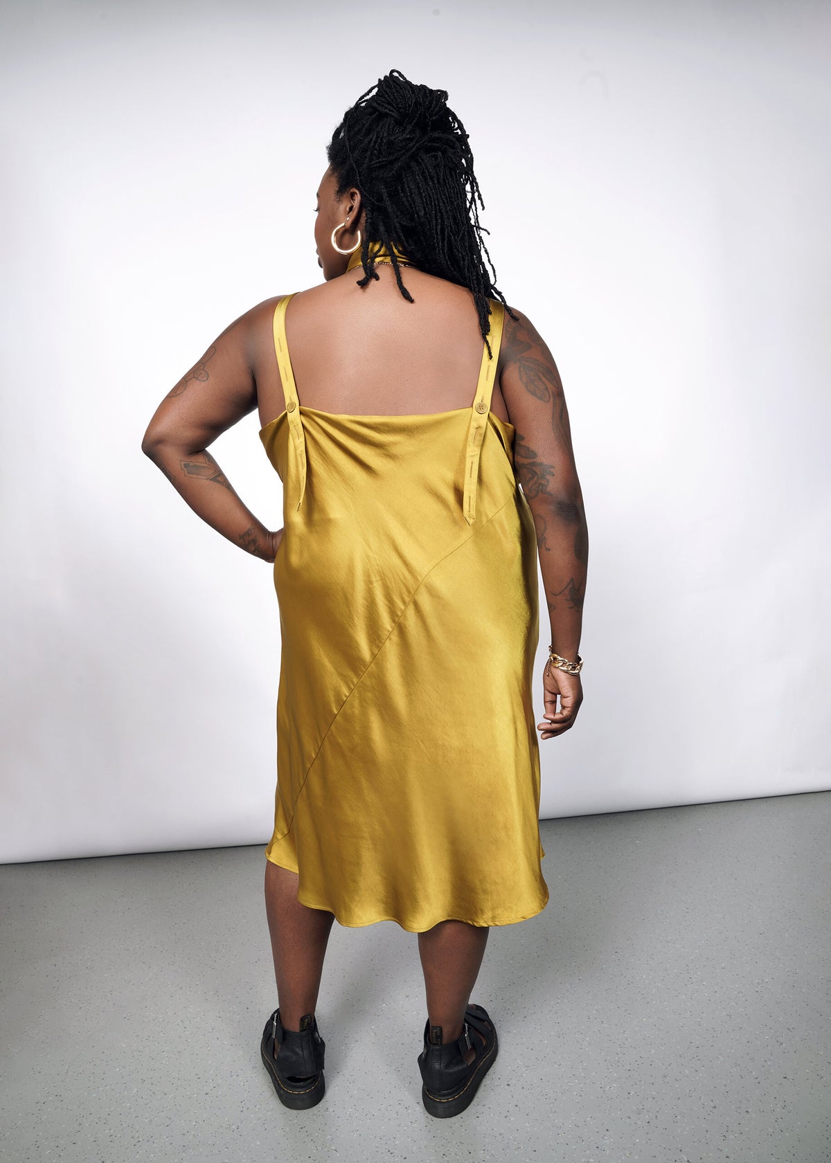 Model wearing The Empower Satin Adjustable Slip Dress in Dijon