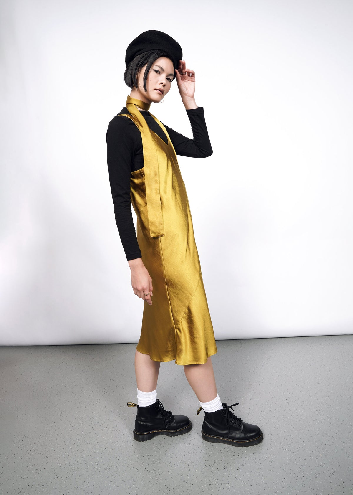 Model wearing The Empower Satin Adjustable Slip Dress in Dijon