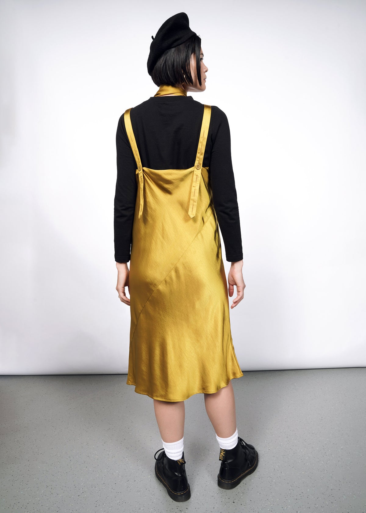 Model wearing The Empower Satin Adjustable Slip Dress in Dijon
